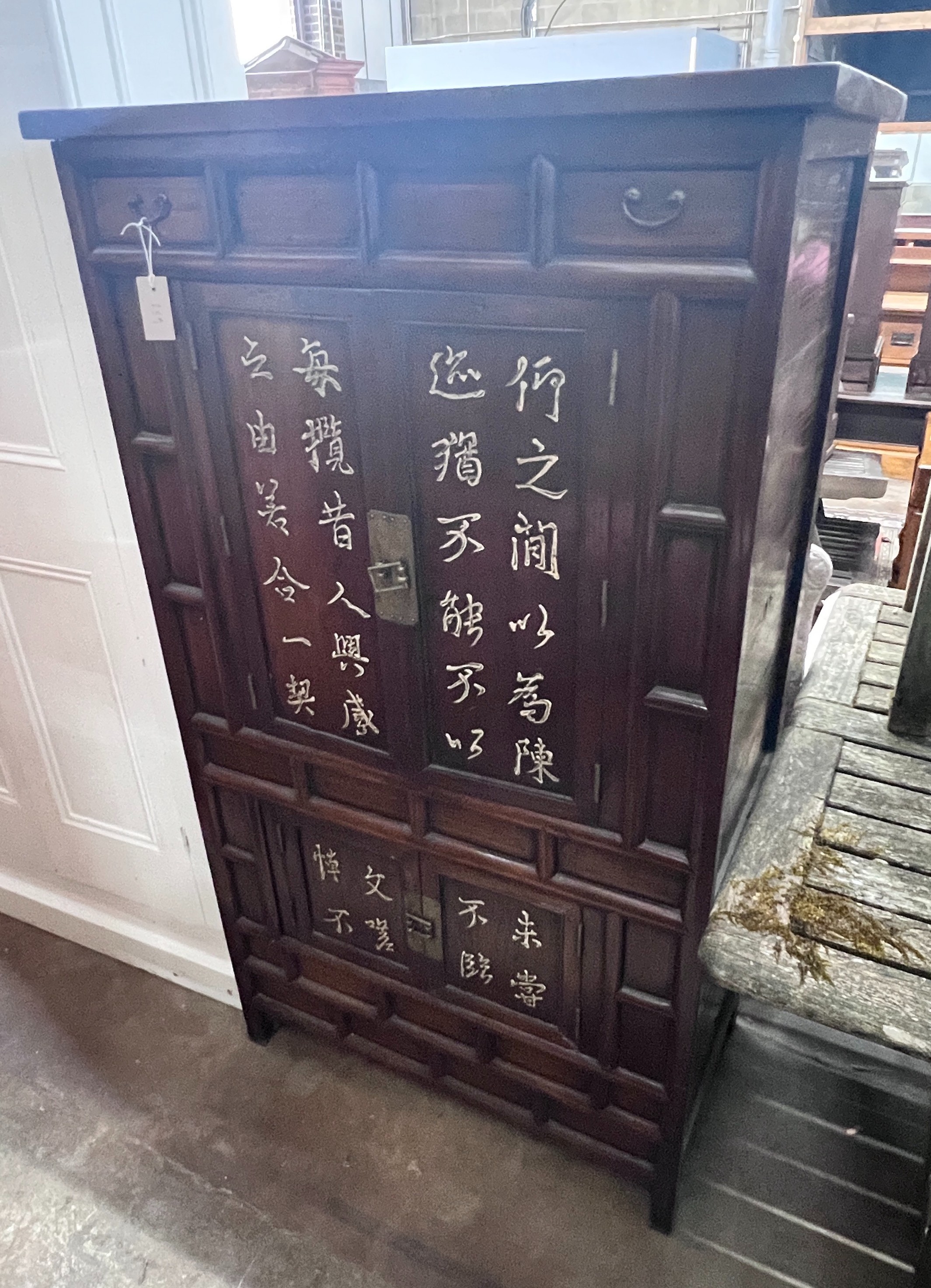 A Chinese elm cabinet, width 88cm, height 155cm *Please note the sale commences at 9am.